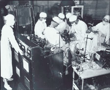 Gibbon operating with the heart-lung machine